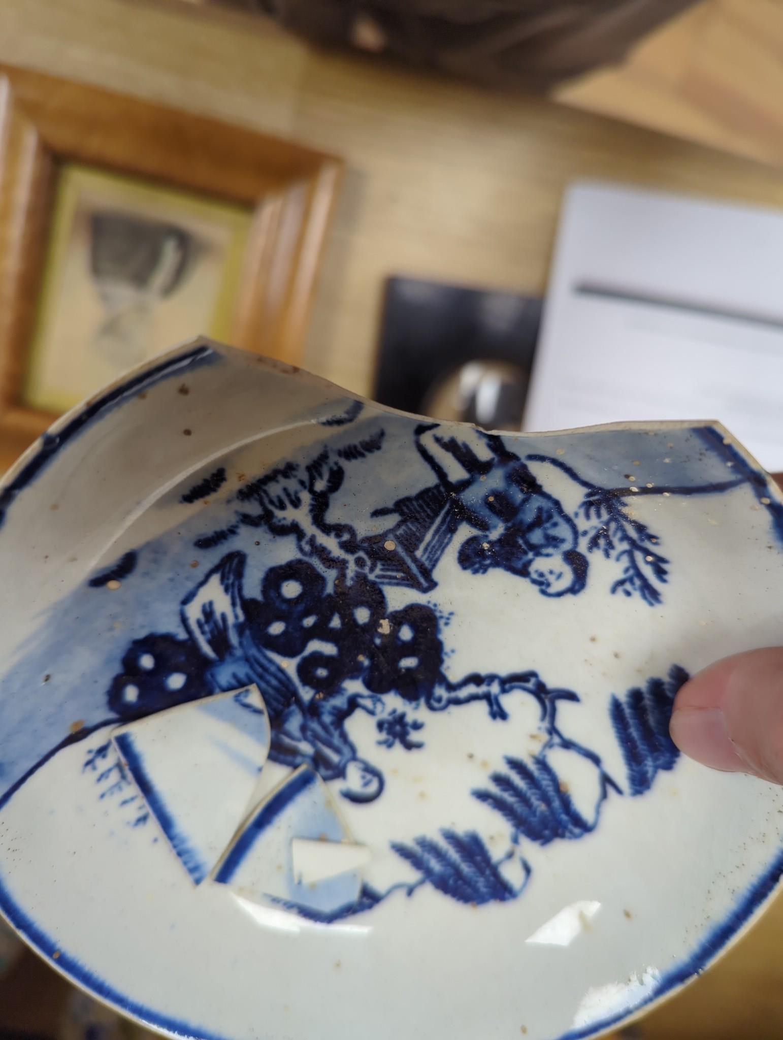 A large group of 18th century Worcester, Caughley and Liverpool blue and white tea bowls, coffee cups and saucers etc. including a Bow Cross-Legged Man